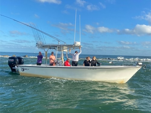 Captain Corey and guest anglers on his fishing boat in Daytona Beach, Florida